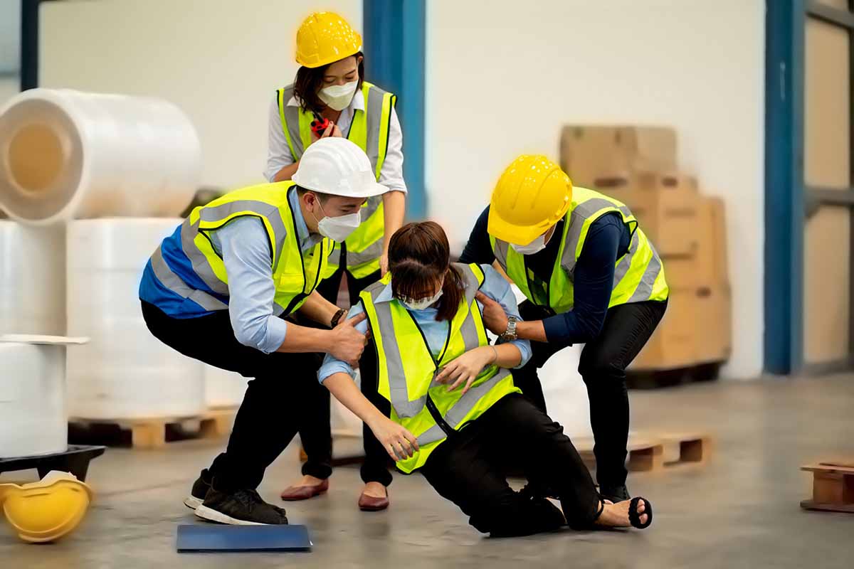 People using their HLTAID011 Course skills to provide assistance in the workplace