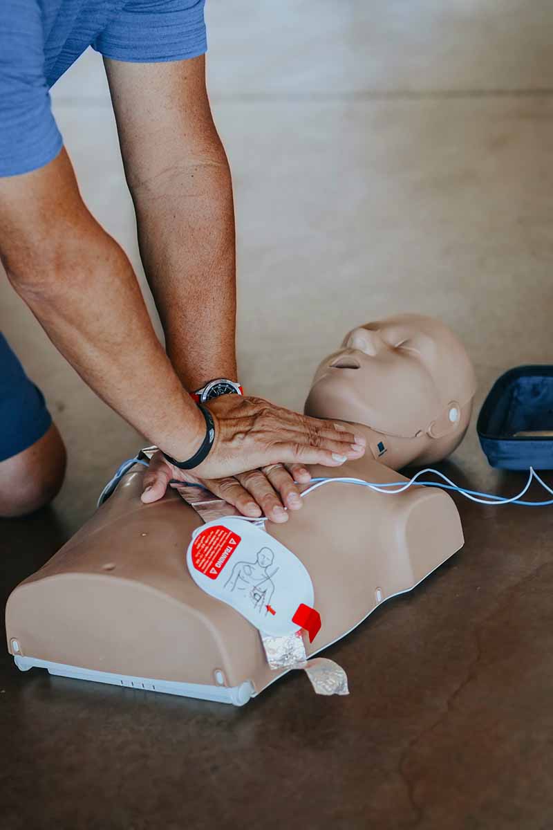 Man using CPR Dummy